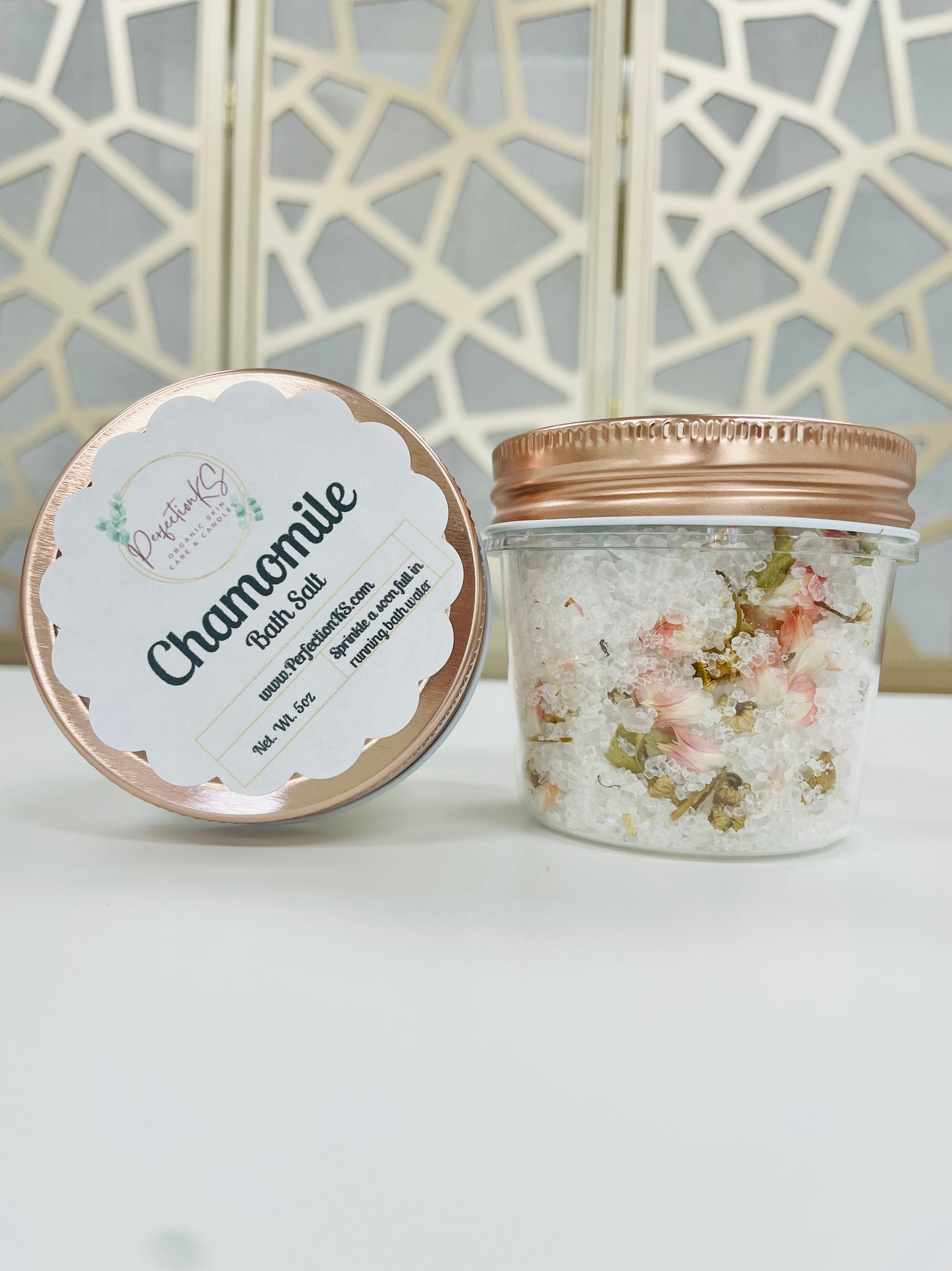 5oc plastic container of Chamomile Bath Salt with a rose gold lid