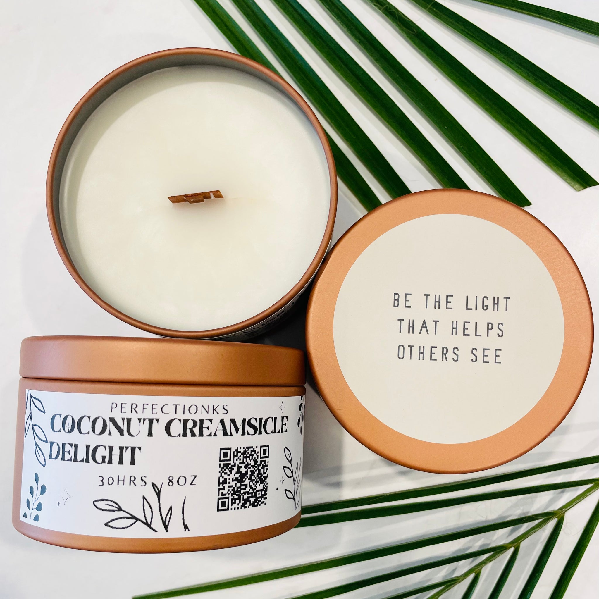 Coconut creamsicle delight luxury candle in a 8oz bronze metal tin with a matching lid 