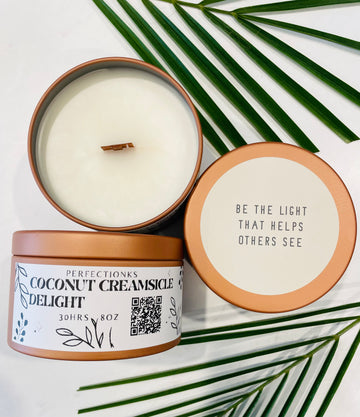 Coconut creamsicle delight luxury candle in a 8oz bronze metal tin with a matching lid 