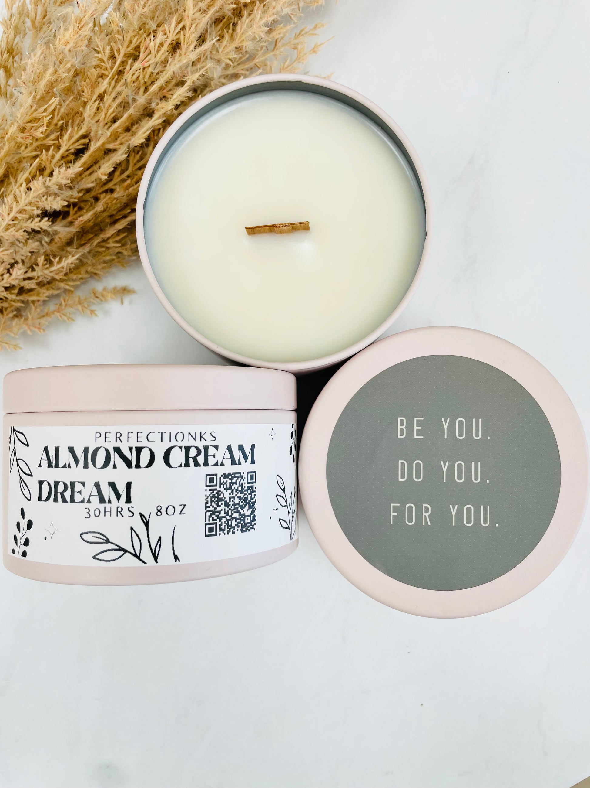 8oz almond cream luxury candle in a pink metal tin with natural crackling wood wick